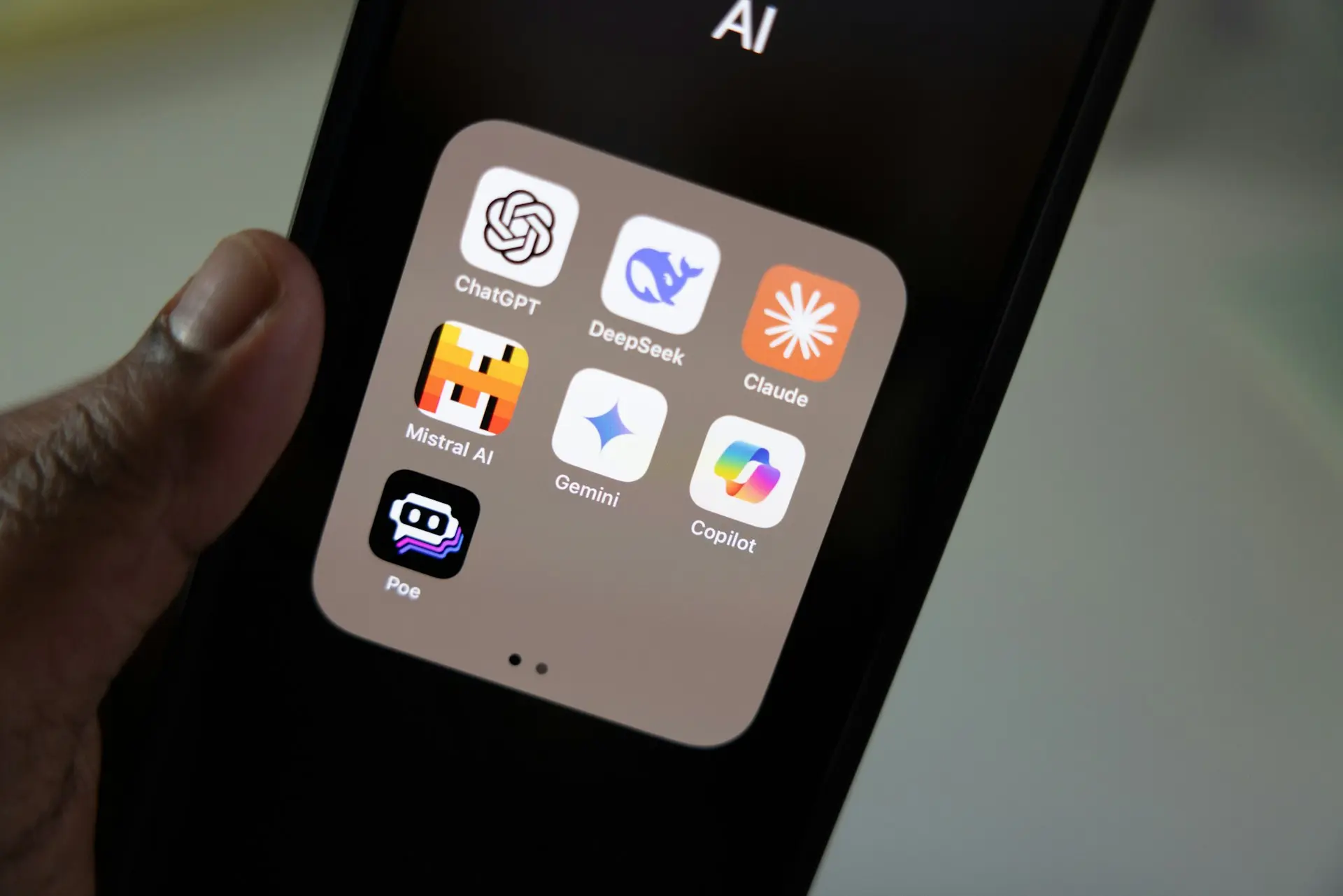 A person holding a smart phone in their hand