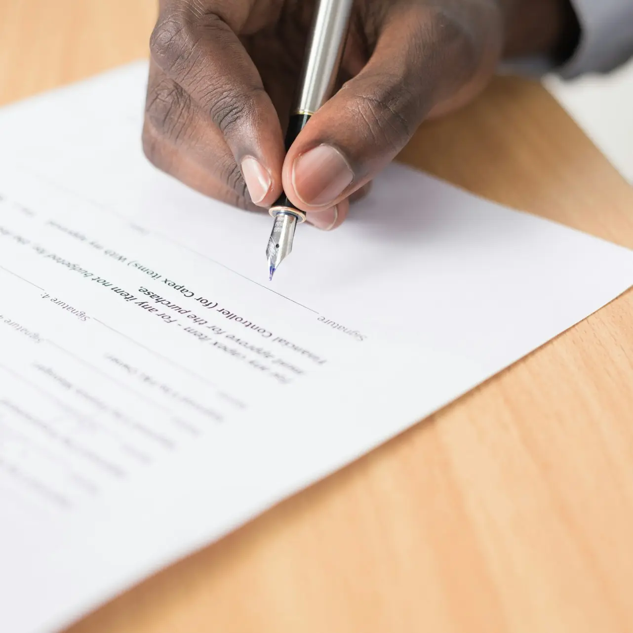 person writing on white paper