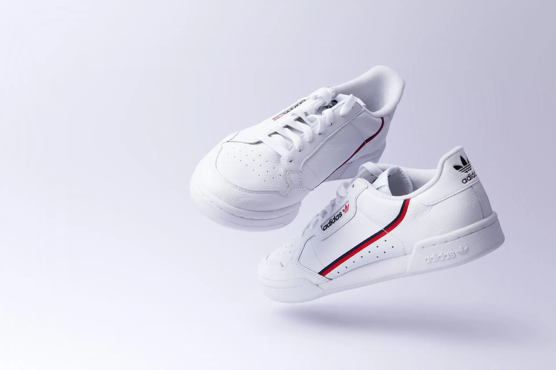 white adidas low-top sneakers